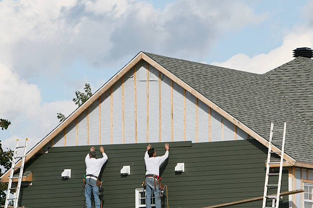 Professional Siding technician working in Great River, NY